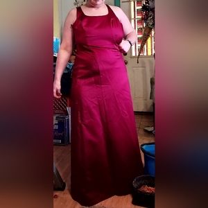 formal full-length satin dress with lace back detail and crinoline underskirts